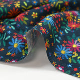 Cotton poplin printed with embroidered flowers on a midnight blue background
