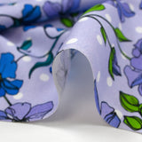 Cotton poplin printed climbing flowers with purple polka dot background