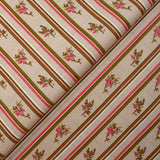 Cotton poplin printed diagonally with flowers on beige background