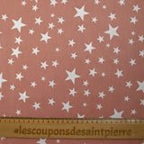 Cotton poplin printed with stars, old pink background