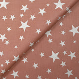 Cotton poplin printed with stars, old pink background