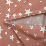 Cotton poplin printed with stars, old pink background