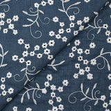 Twill de polyester brodé marguerite fond marine