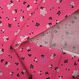 Cotton poplin printed spring flowers barbie pink background