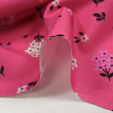 Cotton poplin printed spring flowers barbie pink background