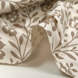 Cotton poplin printed with taupe floral print, off-white background
