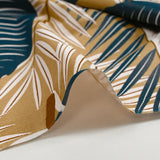 Cotton poplin printed with large leaves, beige background