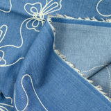 Lucie embroidered cotton chambray denim background
