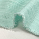 Crépon de polyester effet seersucker vert d'eau