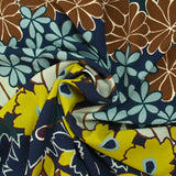 Polyester crepe printed with floral friezes on a navy background