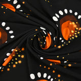 Punto de viscosa satinada con estampado eclipse naranja y fondo negro