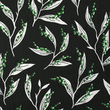 Satin viscose knit printed with a sprig of lily of the valley, black background
