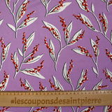 Satin viscose knit printed with a sprig of lily of the valley, mauve background