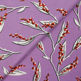 Satin viscose knit printed with a sprig of lily of the valley, mauve background