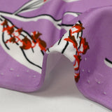 Satin viscose knit printed with a sprig of lily of the valley, mauve background