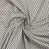 Cotton jersey with dotted diamond print on ecru background