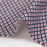 Cotton jersey printed red polka dots with navy circle and white background