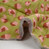 Double-sided quilted gauze Bangkok white and green background by the meter