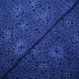 Cotton poplin printed with floral garden on a navy blue background