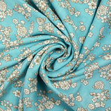 Off-white spring printed viscose with azurin blue background