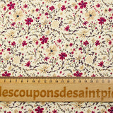 Cotton poplin printed with burgundy and beige flowers on an ecru background