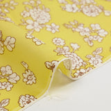 Off-white spring printed viscose with sulfur yellow background