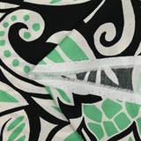 Cotton satin with green and white tribal jungle print, black background