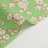 Off-white spring printed viscose with light green background
