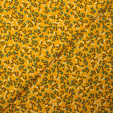 Cotton poplin printed with blue flower shoot and sunny yellow background