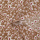 Viscose printed with white and burgundy flowers, hazelnut background