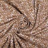 Viscose printed with white and burgundy flowers, hazelnut background