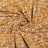 Viscose printed with white and burgundy flowers, ocher background