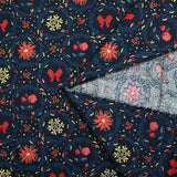 Popeline de coton imprimée poinsettias et nœuds rouge fond bleu marine