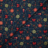 Popeline de coton imprimée poinsettias et nœuds rouge fond bleu marine