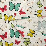 Cotton poplin printed with butterfly polka dots, beige white background