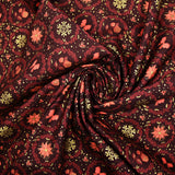 Popeline de coton imprimée poinsettias et nœuds orange fond marron