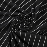 Dyed woven cotton with white stripes and black background