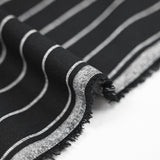 Dyed woven cotton with white stripes and black background