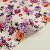 Cotton poplin printed with purple and orange rose bush on white background