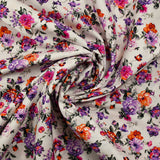Cotton poplin printed with purple and orange rose bush on white background