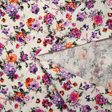 Cotton poplin printed with purple and orange rose bush on white background