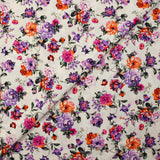 Cotton poplin printed with purple and orange rose bush on white background
