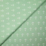 Algodón estampado con ancla marina blanca y fondo verde mar.