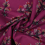 Cotton poplin printed with satellite flowers on a purple background