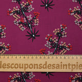 Cotton poplin printed with satellite flowers on a purple background