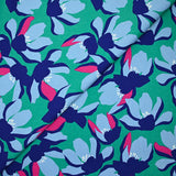 Satin de coton élasthanne fleurs bleu fond vert menthe