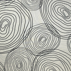 Popeline de coton imprimée escargot noir fond beige clair
