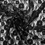 Martha metallic silver polyester lace with black background