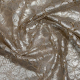 Silver laminated cotton guipure on an ecru background