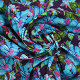 Cotton printed exotic flowers blue and green purple background